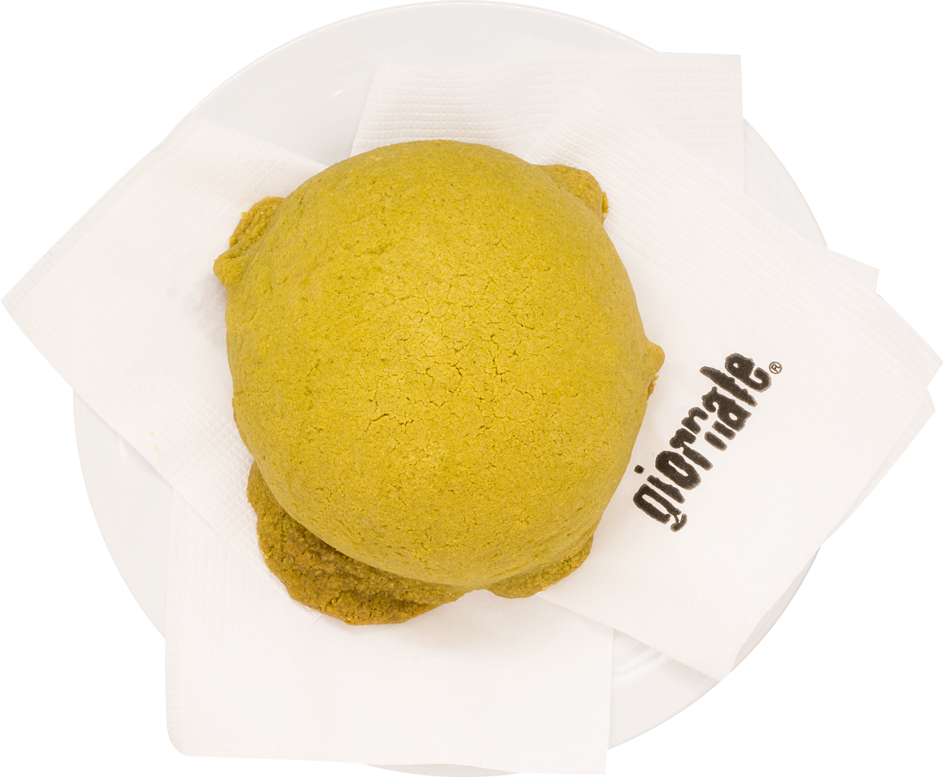 Concha de Matcha sobre un plato con servilletas de Giornale